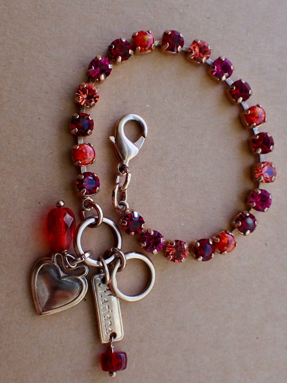 Mariana Gold-Tone Heart Charm Bracelet with Red and Pink Crystal Accents
